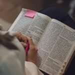 Woman reading Christian fiction books online while using Christianbook Christian Fiction Coupon Code from Coupon Roach for savings on inspirational stories