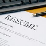 Job seeker creating a professional resume online using My Perfect Resume deals to reduce job search expenses