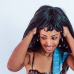Woman showcasing a stylish UNice premium human hair bob wig with a verified coupon code offer for affordable online beauty shopping