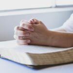 Reader exploring faith-based books online while using Christianbook coupon code deals to save money on Christian literature and Bible study resources