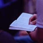 Seminary and Bible college students studying with Christian books and academic resources while using Christianbook coupon code deals to save money online